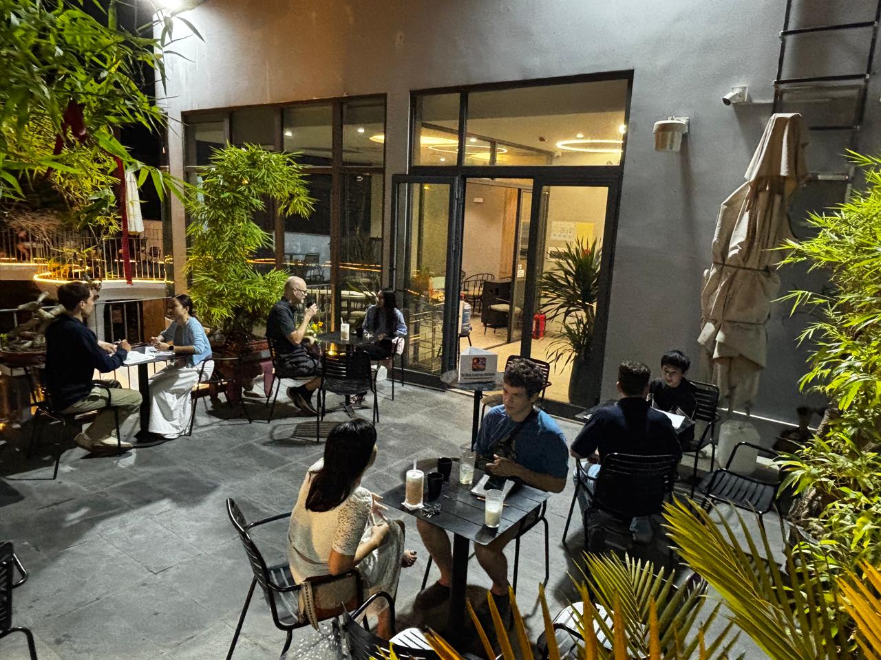 A wide outdoor view of the Friday, May 1, 2026 Da Nang Language Exchange meetup at Heaven Coffee.